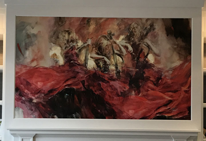 Hand embellished giclee on canvas glued on the wall above the fireplace in a family room